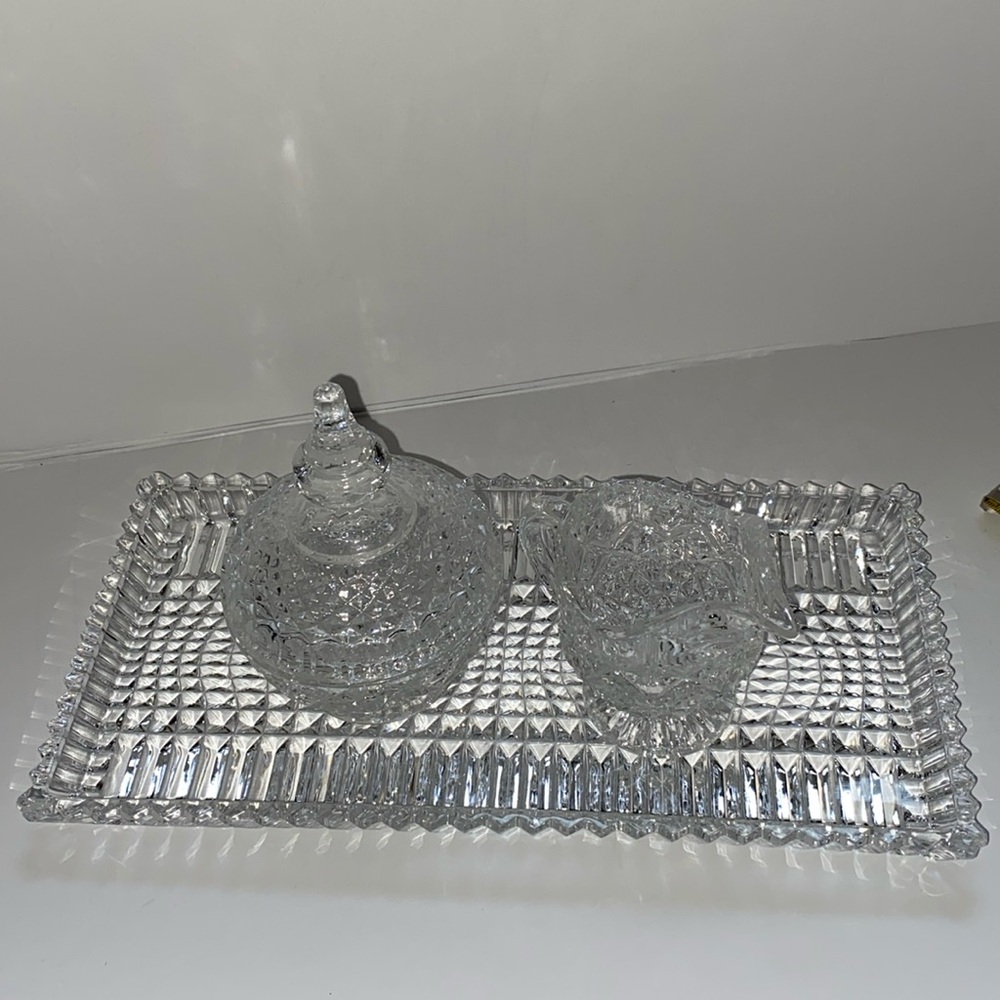 Brilliant vintage cut clear glass cream , and lidded sugar.